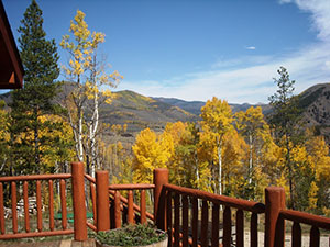 view of fall aspens and the hills from a deck in Shadow Mountain Ranch